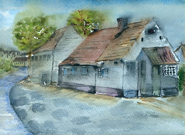 Calle con casas y árboles.