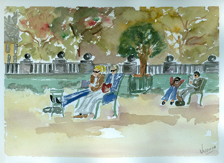 Personas leyendo y charlando en un parque.