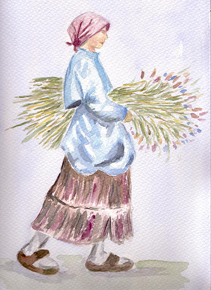 Campesina caminando con un ramo de flores.